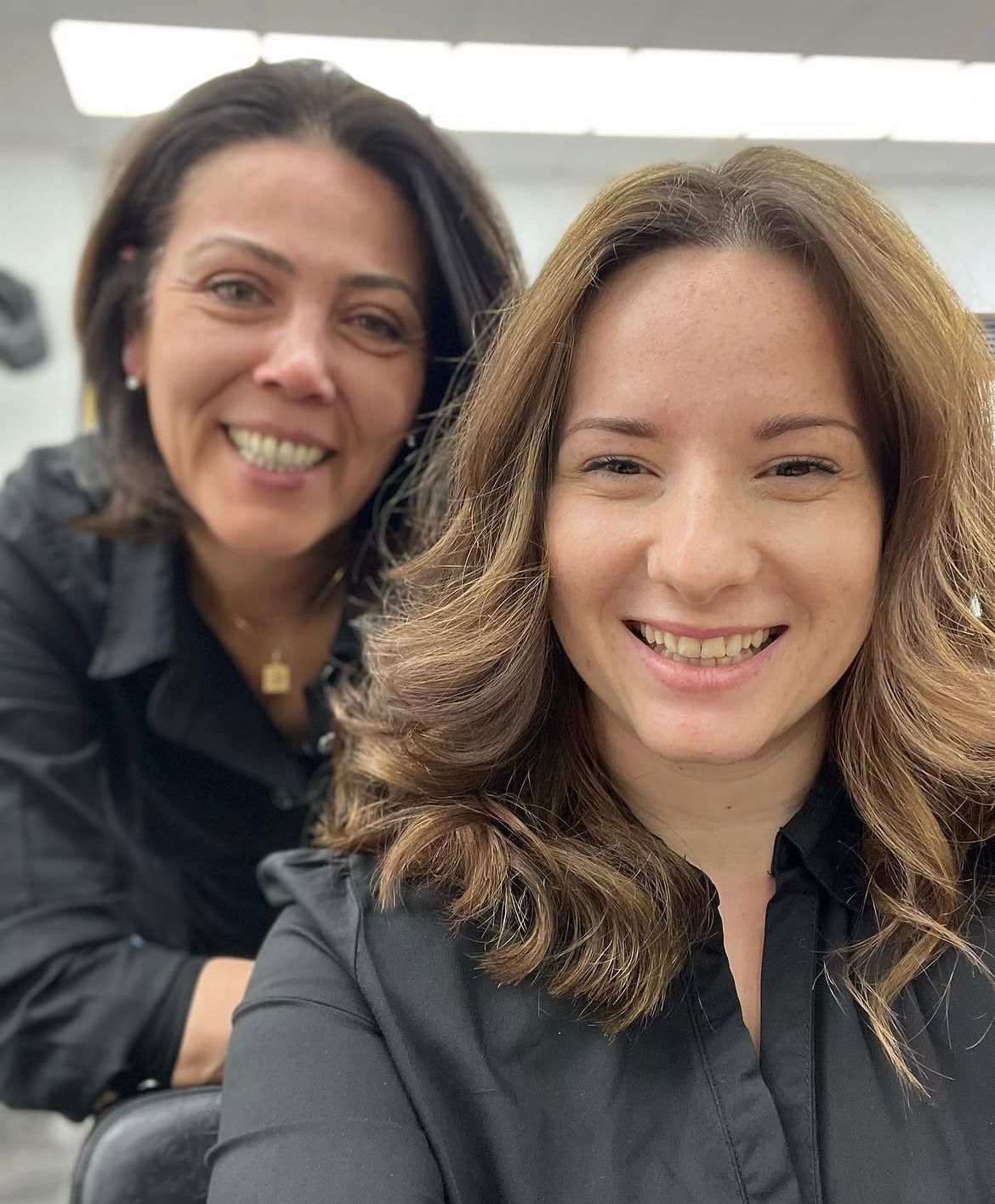 Happy client with hairdresser Alfiya in Finchley Central